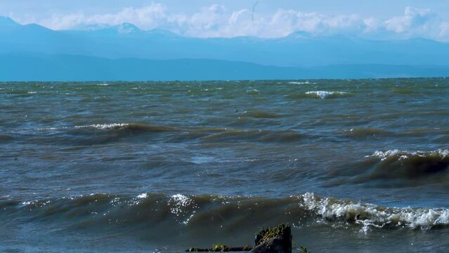Polluted lake.  Close view waves in the lake.  Close view Sevan lake in Armenia, Caucasus. Mountain lake. 