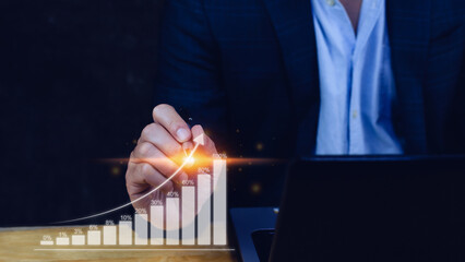 Businessman showing business growth on graph Hands touching graphs representing increasing profits, financial symbols coming