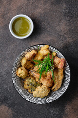 Japanese prawns and vegetable tempura on dark background