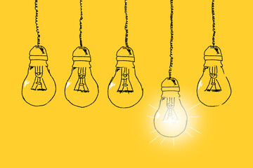Set of light bulbs hand drawn on a yellow background. Concept of unique thinking. Idea concept.