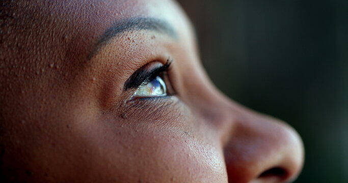 African person eyes looking at sky with HOPE and FAITH, spiritual happiness
