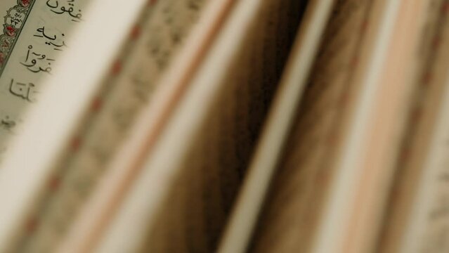 The Holy Quran Book, koran Chapter, flipping pages Close up Macro.