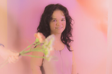 Fototapeta premium Woman posing with flowers