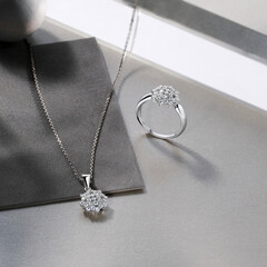 Elegant jewelry set, necklace and earrings with diamonds. Jewellery set with gemstones. Product...