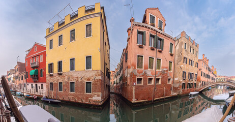 Panorama of old traditional Venetian houses along the canal.