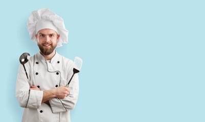 Smiling young Chef in Cooking Uniform