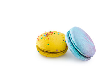 Sweet colorful macarons isolated on white background. Tasty colourful macaroons. Two multi-colored blue and yellow macaroons. French pastry made from egg whites.