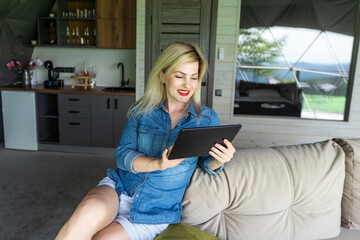 Happy young woman with tablet pc