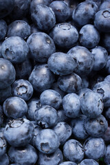 Blueberries as a natural textured background. Many ripe blueberries close-up. Berries for dessert. Healthy lifestyle, vegetarian sweet snack