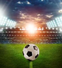 Classic football ball on big stadium