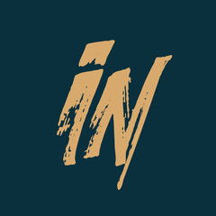 IN monogram logo. Ink, brush calligraphy letter i, letter l icon.Lettering sign.Signature alphabet initials isolated on dark fund.Handwritten, graffiti style character.