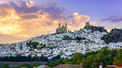 Panoramic view of the village of Olvera with its white houses on the mountainside at sunset, Cadiz.