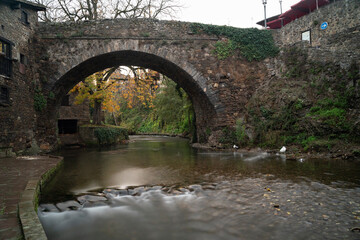 view of a bridge over a river in the village of Potes in Cantabria, Spain