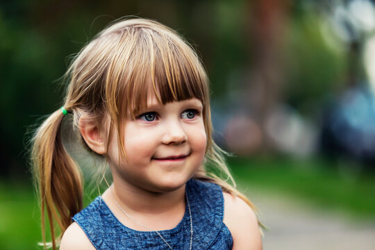 Portrait of a cute young girl with blond hair in pigtails; Edmonton, Alberta, Canada
