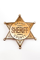 vintage far west sheriff badge, isolated