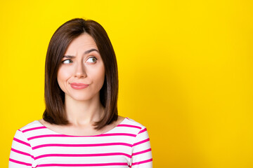 Fototapeta premium Closeup photo of young attractive beautiful woman play eyebrow looking empty space distrust isolated on yellow color background