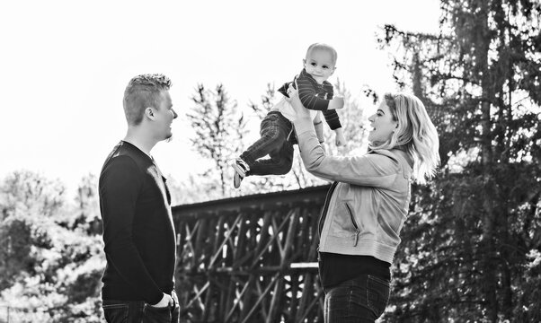 A family enjoying a day outdoors in a city park during the fall season; St. Albert, Alberta, Canada