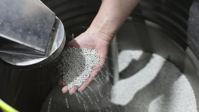 Man hand holding PP Pet POLYPROPYLENE Chips Semi Dull, PET chips recycle, PET polyester chips