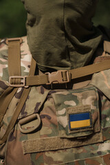 A soldier in specialized ammunition. Special tactical backpack. Backpack for fishing and hunting