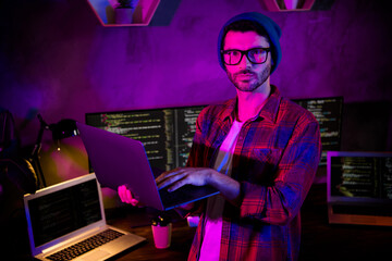 Photo of confident cool freelancer wear hat eyeglasses administrating system modern gadget indoors...