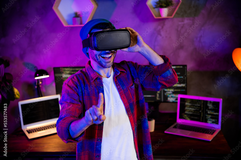 Aufkleber photo of funny smiling coder dressed hat eyewear teating 3d game modern gadget indoors workplace wor