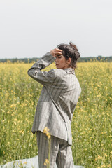 An Asian model poses in a field of yellow flowers for a clothing brand, polyethylene is the main...