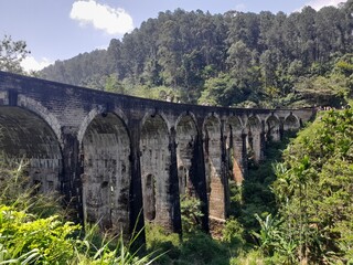 Fototapeta na wymiar Nine arch Bridge in Sri Lanka. Old bridge in Ceylon between Ella and Demodara railway stations