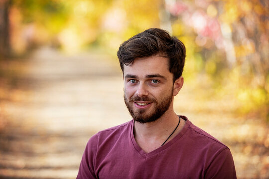 Portrait of a paraplegic man outdoors in a park in autumn; Edmonton, Alberta, Canada
