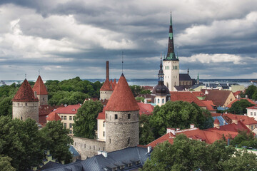 View of old Tallinn from the observation deck. Famous and beautiful view of the old town with watchtowers and Oleviste Church. Summer season in Estonia.