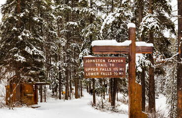 Sign on walking trail in Johnson Canyon during winter in Banff National Park; Alberta, Canada