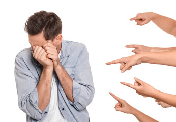 People bullying scared man on white background