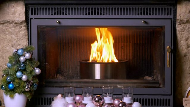 The fireplace burns with a special pellet cast iron bowl. High quality 4k footage