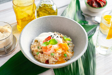 Risotto with shrimp and vegetables served in a bowl