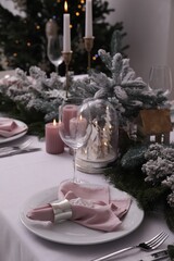 Beautiful festive table setting with Christmas decor indoors