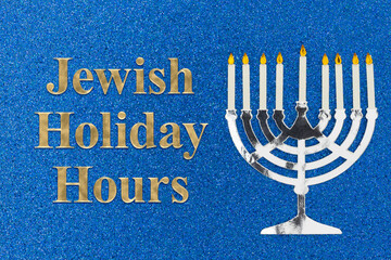 Jewish Holiday Hours message with a menorah