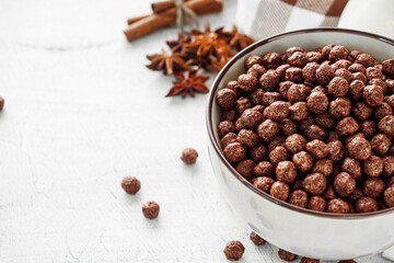 sweet crunchy chocolate children's breakfast chocolate balls on a white background