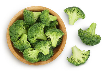 fresh broccoli in wooden bowl isolated on white background close-up with full depth of field. Top view. Flat lay - obrazy, fototapety, plakaty