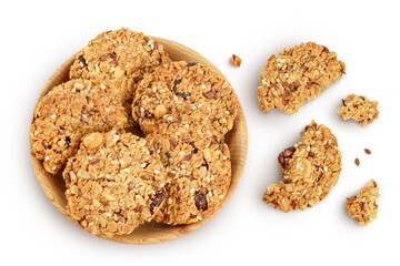 Granola cookie in wooden bowl isolated on white background with full depth of field. Top view. Flat lay.