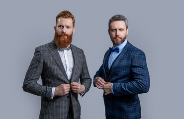 successful two men in tuxedo menswear. studio shot of men wearing menswear. elegant men