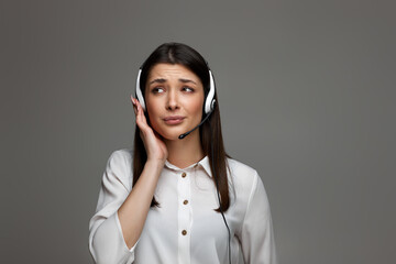 friendly smiling woman with headset is consulting clients online.