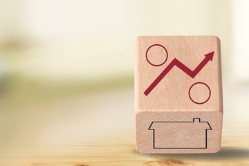 House investment concept. Wooden cubes on desk