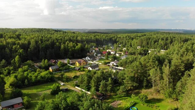 Country houses in the woods. Drone video.
