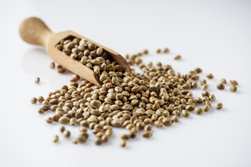natural hemp seeds on a white acrylic background