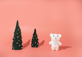 Toy polar bear with Christmas trees. Concept of New Year holidays.