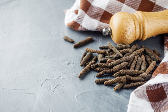 dried fragrant pippali long pepper on a stone background