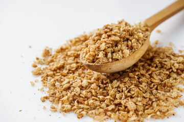 fresh raw buckwheat flakes on a white background