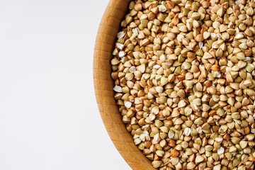 organic raw green buckwheat on a white background
