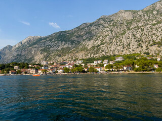 Fototapeta na wymiar Sunset over the villas and houses of Montenegro.