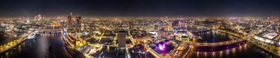 Epic night aerial view of the London, River Thames, London Eye, Westminster. Panorama cityscape - obrazy, fototapety, plakaty