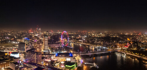 Fototapeta na wymiar Epic night aerial view of the London, River Thames, London Eye, Westminster. Panorama cityscape